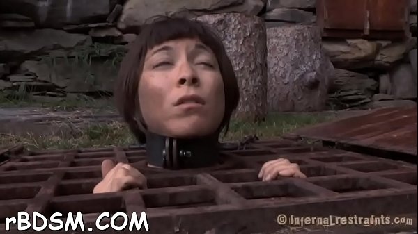 Tied up girl waits with fear for her next hot t.